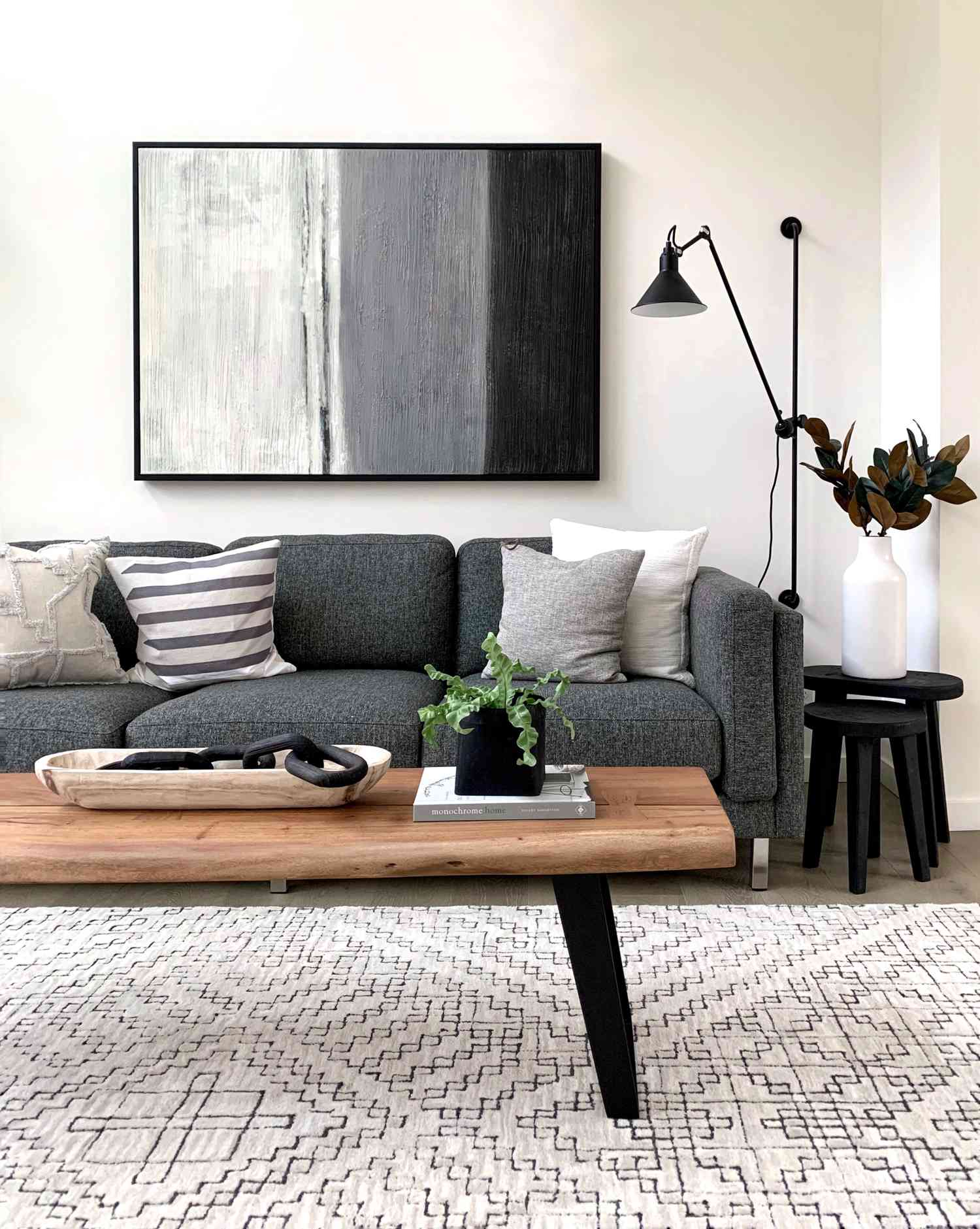 modern living room with gray sofa, black and gray accents