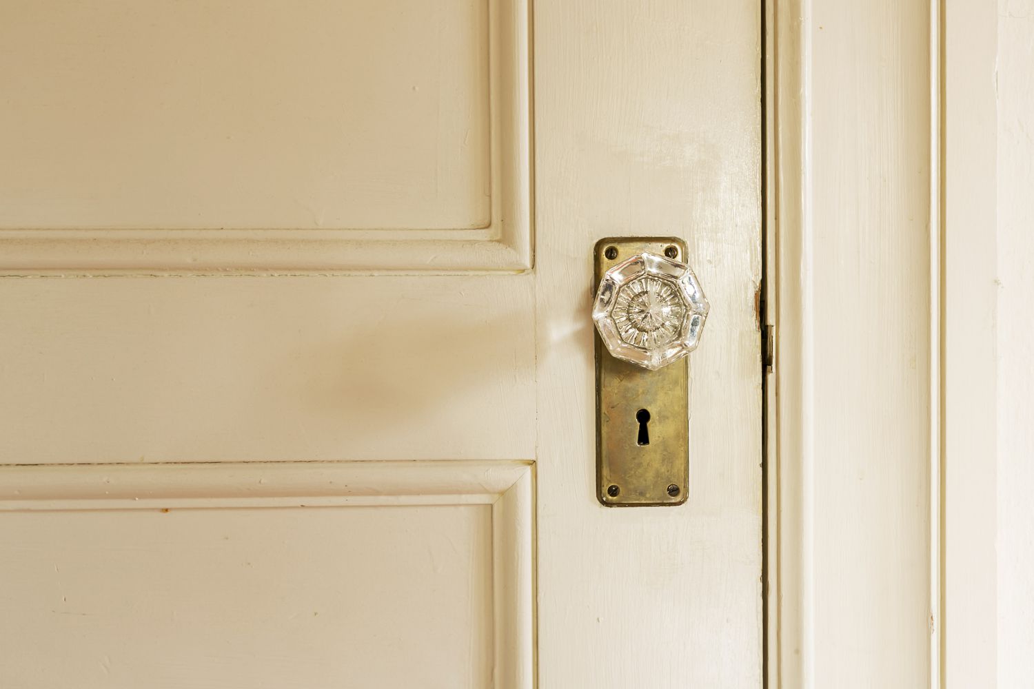 crystal door knob on a cream-colored door