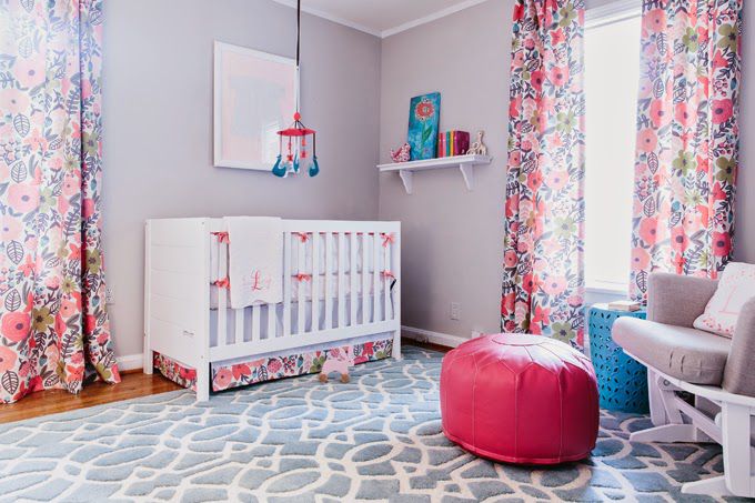 Neutral grey nursery space with colorful floral accents