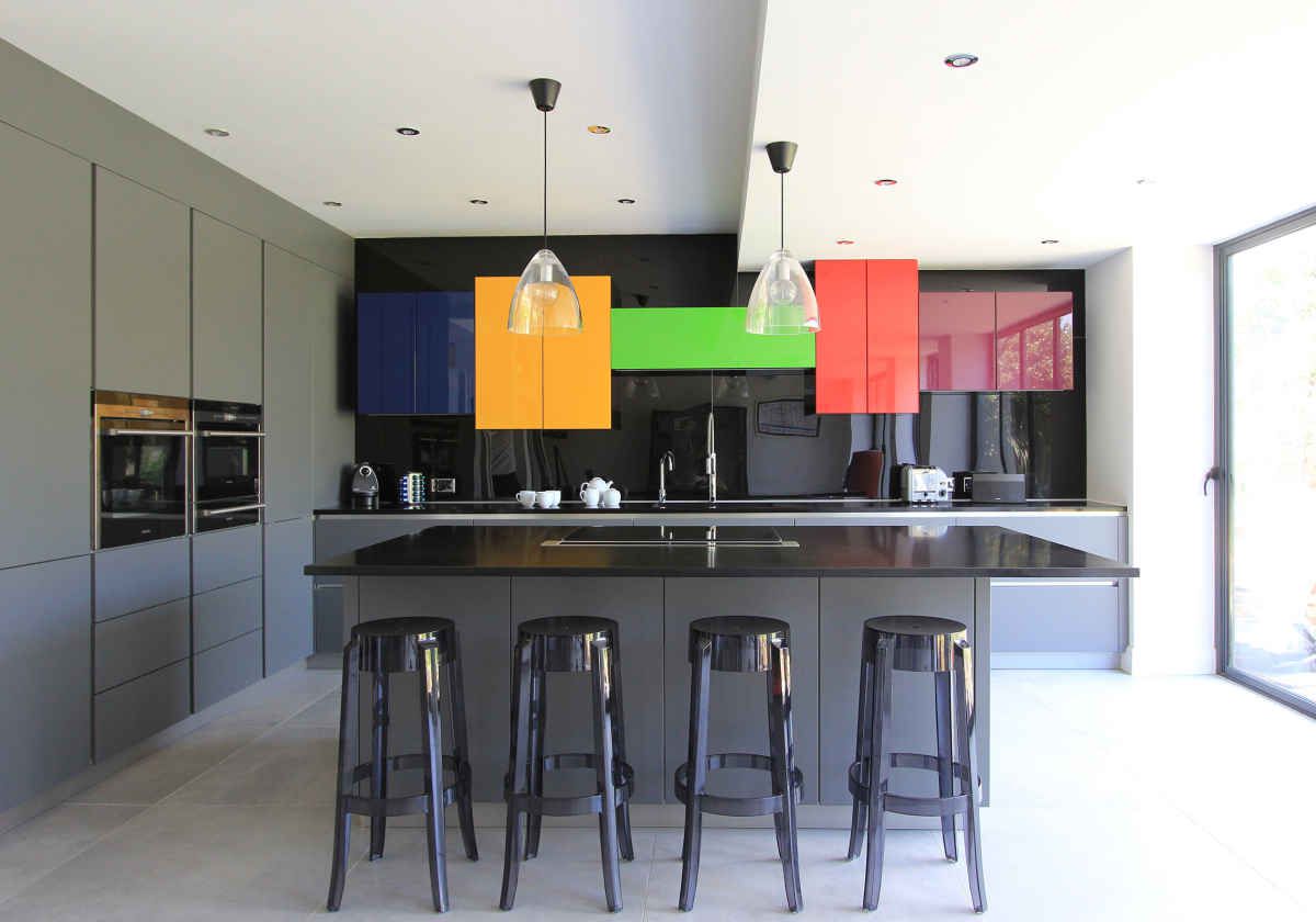 black kitchen with bright colored kitchen cabinets