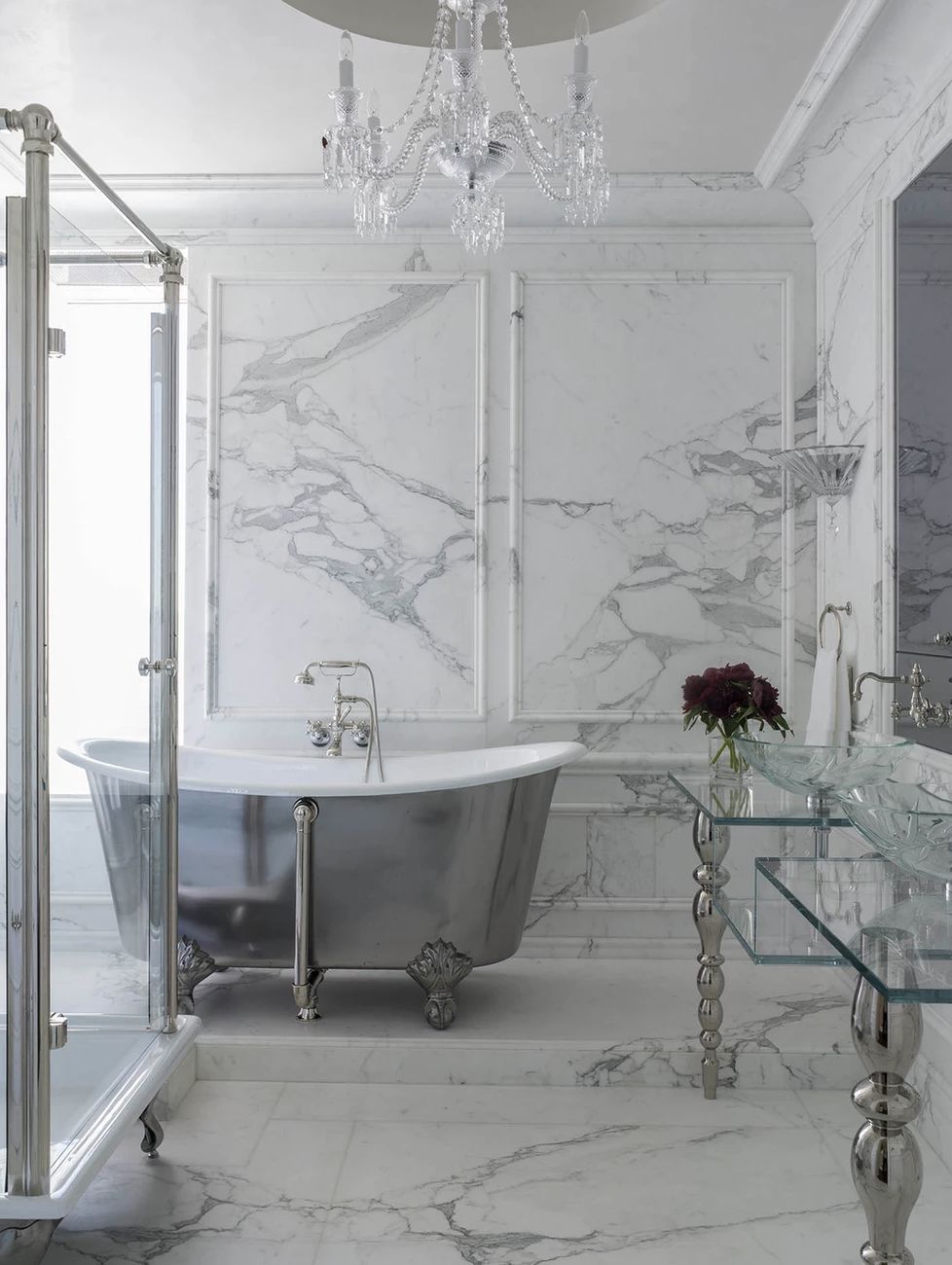 marble bathroom with chrome clawfoot tub 