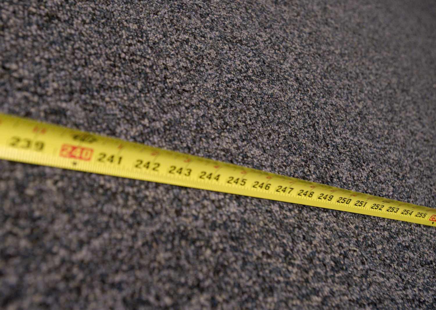 Tape measure laid across carpet