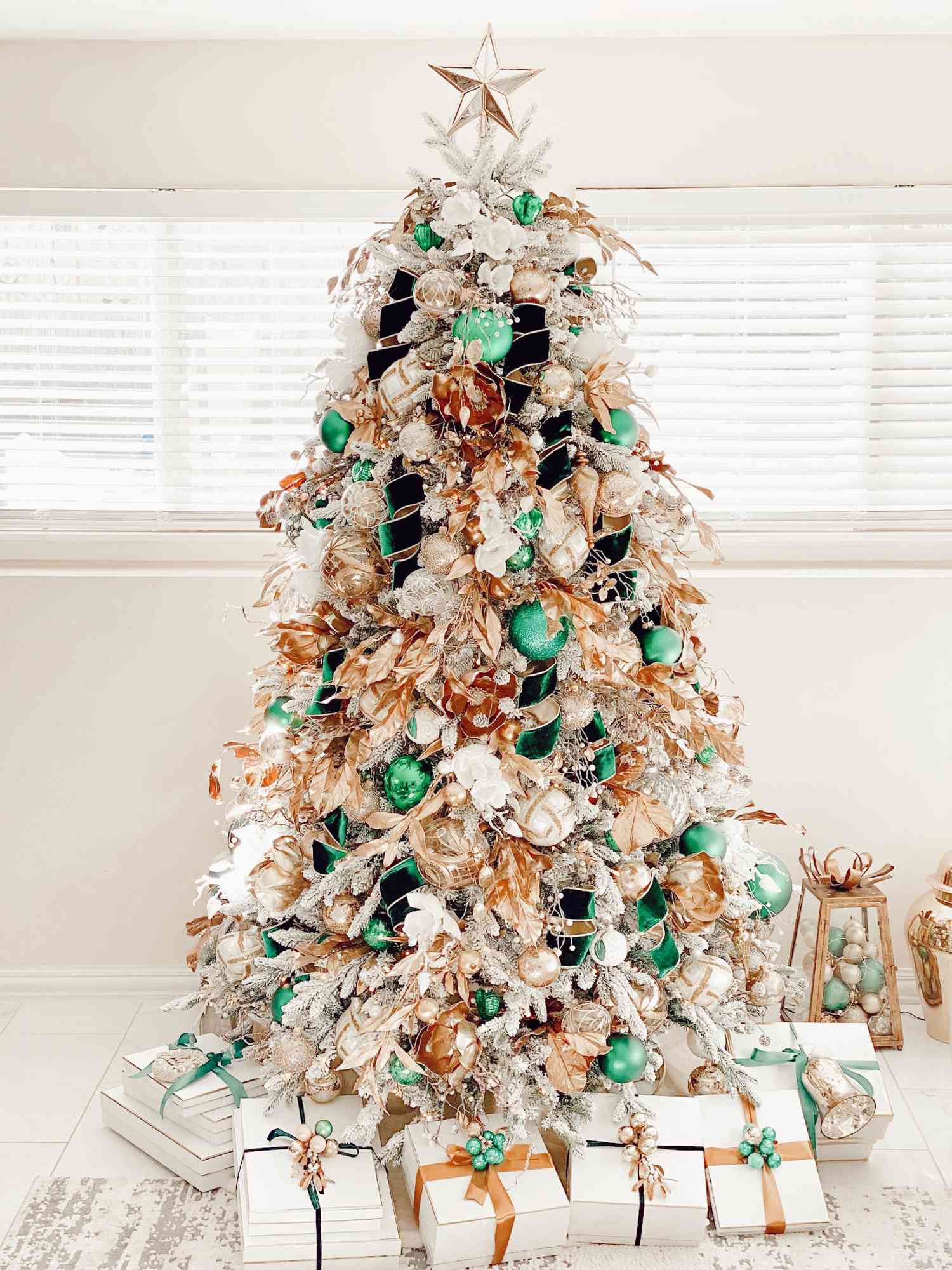 Maricela Caballero's white Christmas tree with emerald green and gold ornaments