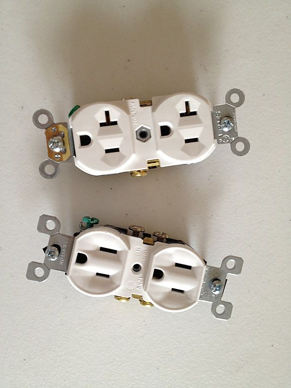 Close up of two outlet receptacles.
