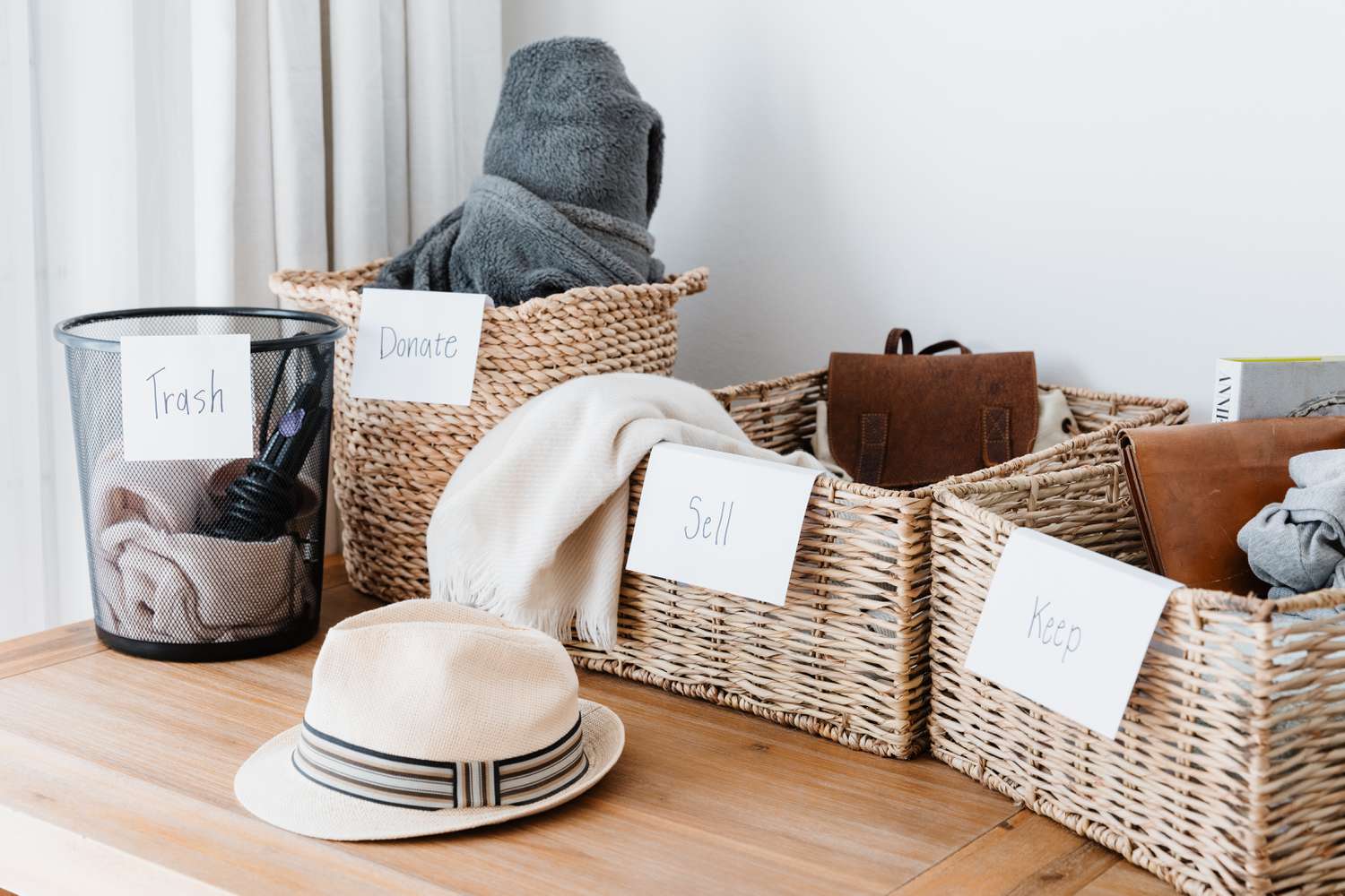 Household items being downsized and separated in wicker baskets