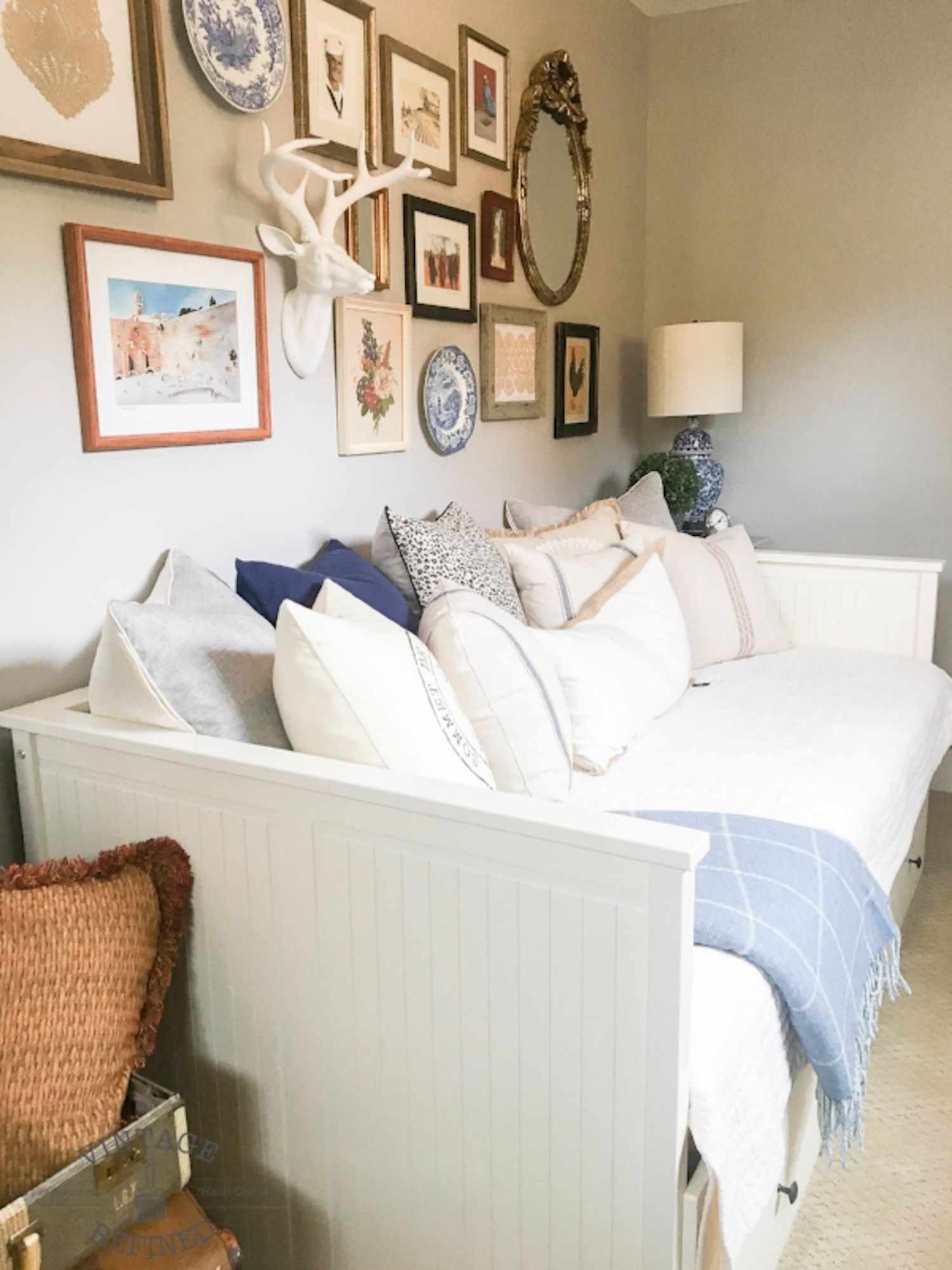 vintage gallery wall over daybed
