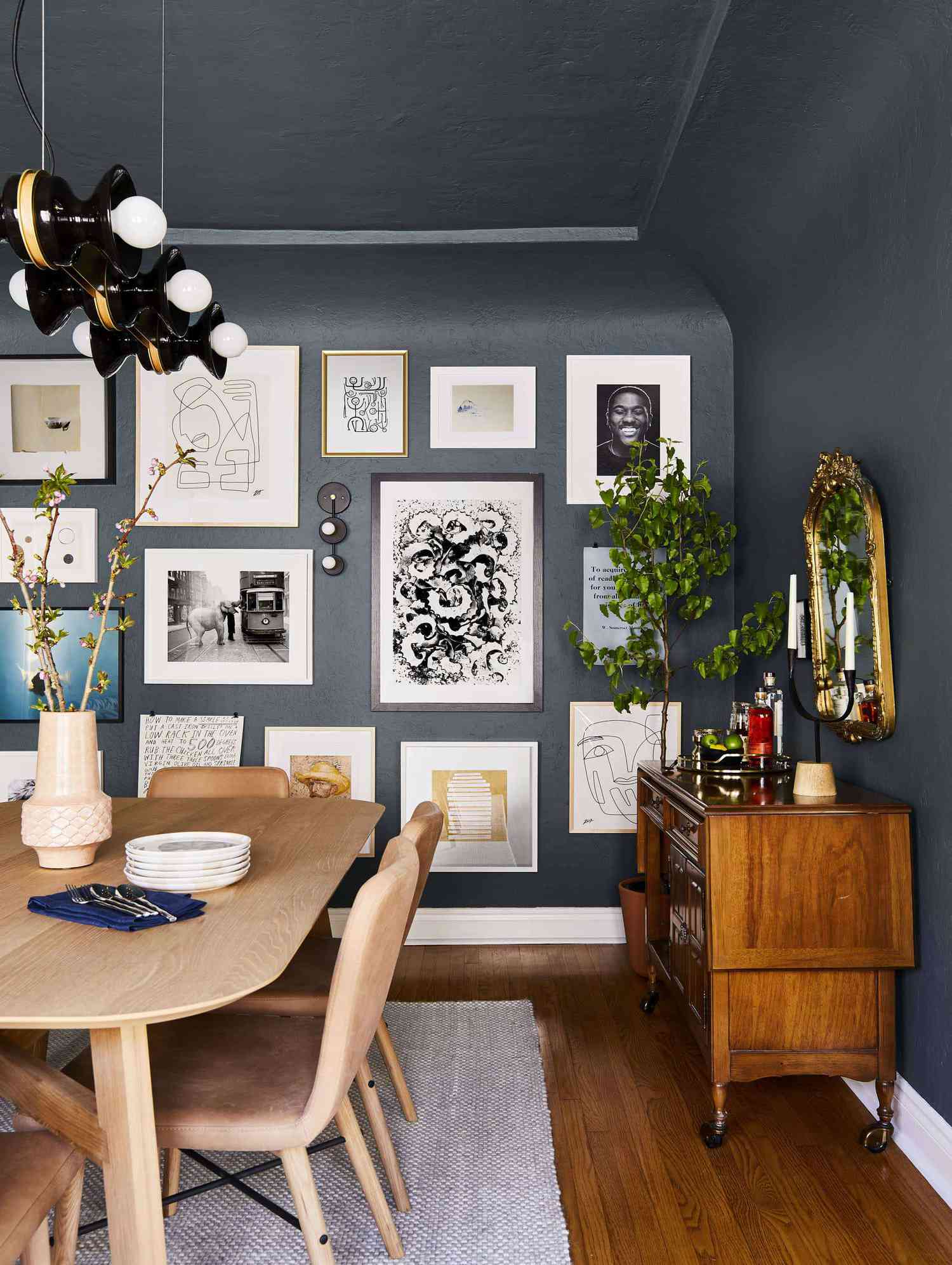 moody blue walls, gallery wall in dining room