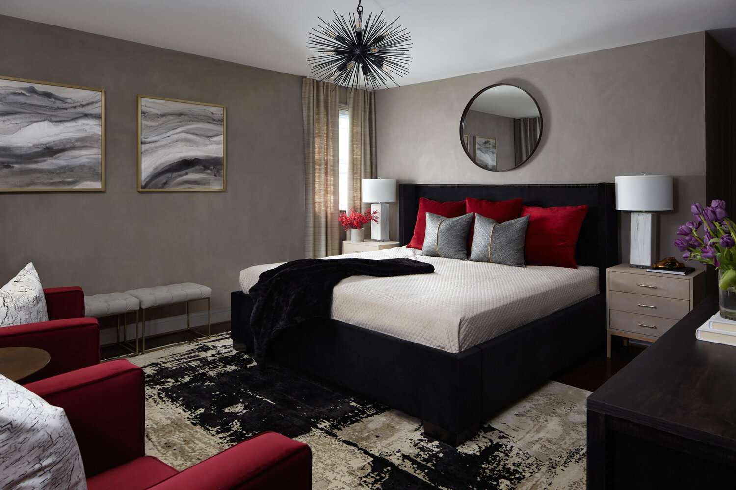 bedroom with neutral color scheme, pops of red, starburst chandelier 