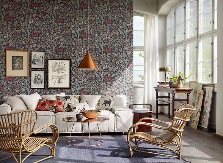 living room interior with floral wallpaper and large windows