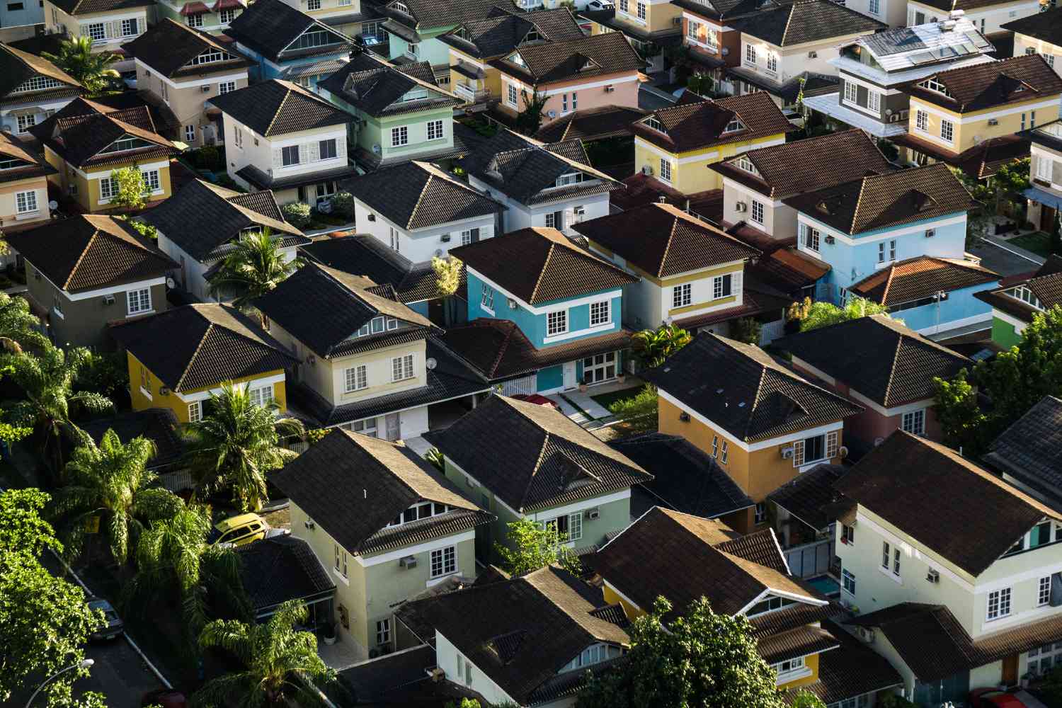 an aerial view of a colorful neighborhood of homes
