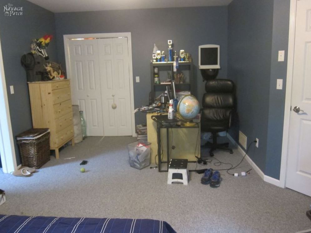 Teen boy's messy study area in bedroom.