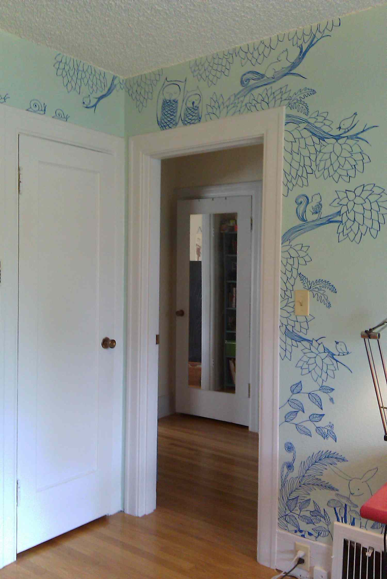 whimsical Sharpie art doodles around doorway