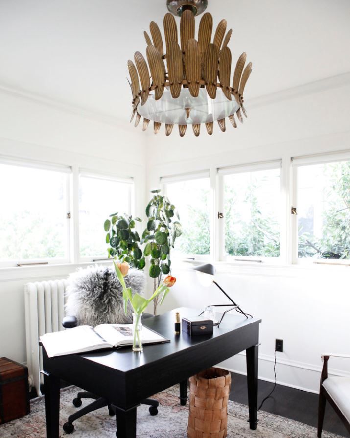 Home office with large light fixture