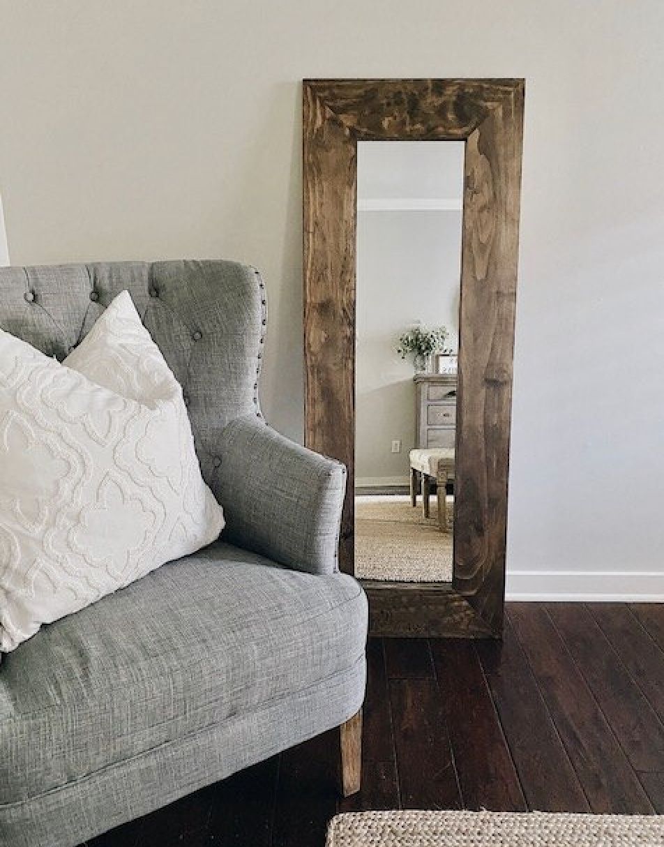 a full-length DIY mirror frame in rustic wood