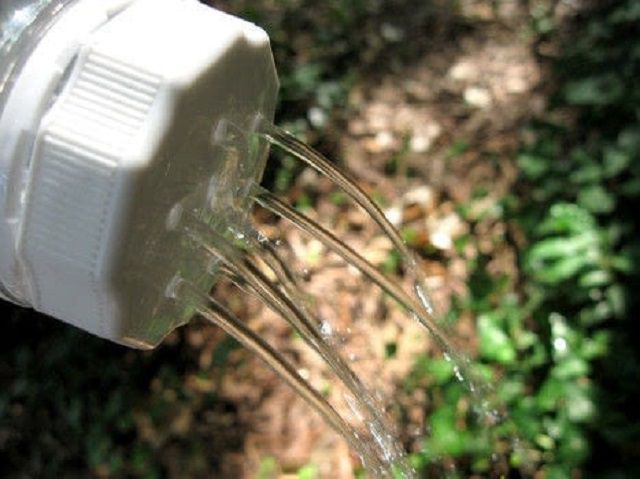 Juice bottle watering can