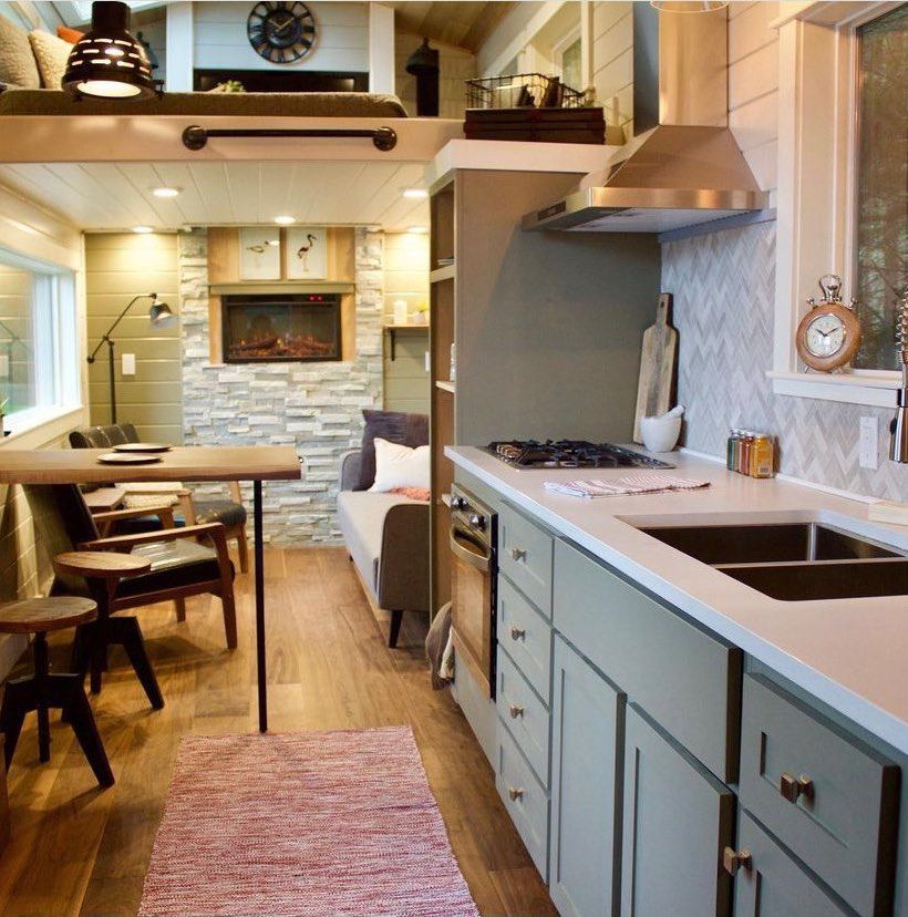 A tiny home kitchen with a geometric backsplash