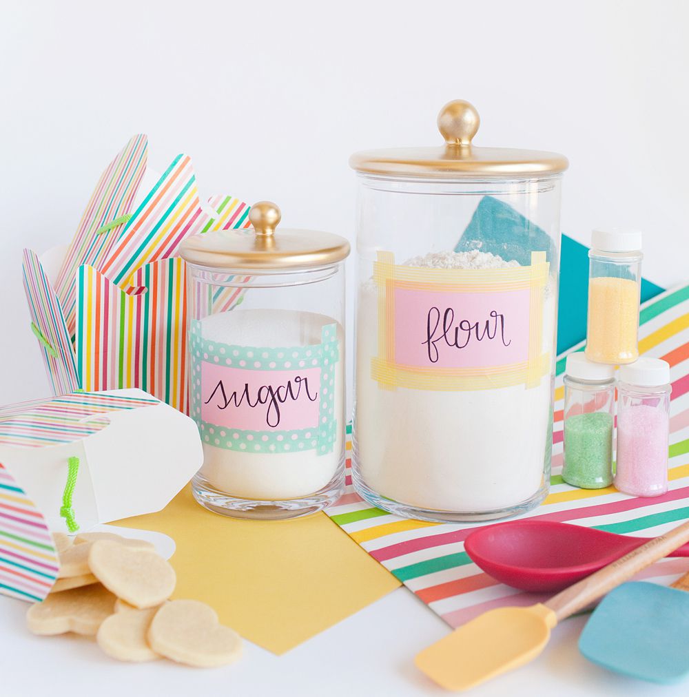 DIY baking jars on counter with baking supplies and utensils