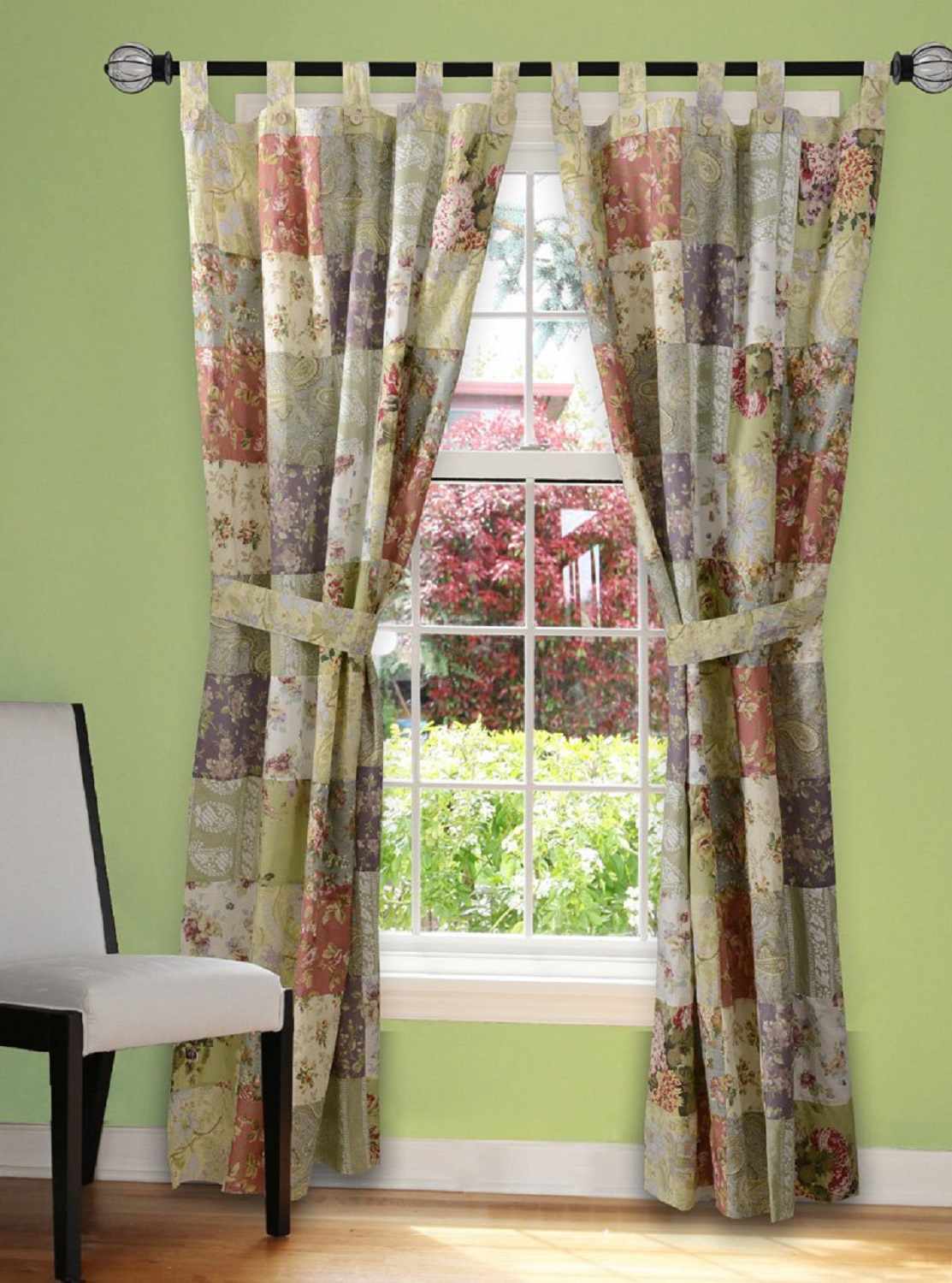 tab top colorful patchwork curtains tied back over window 