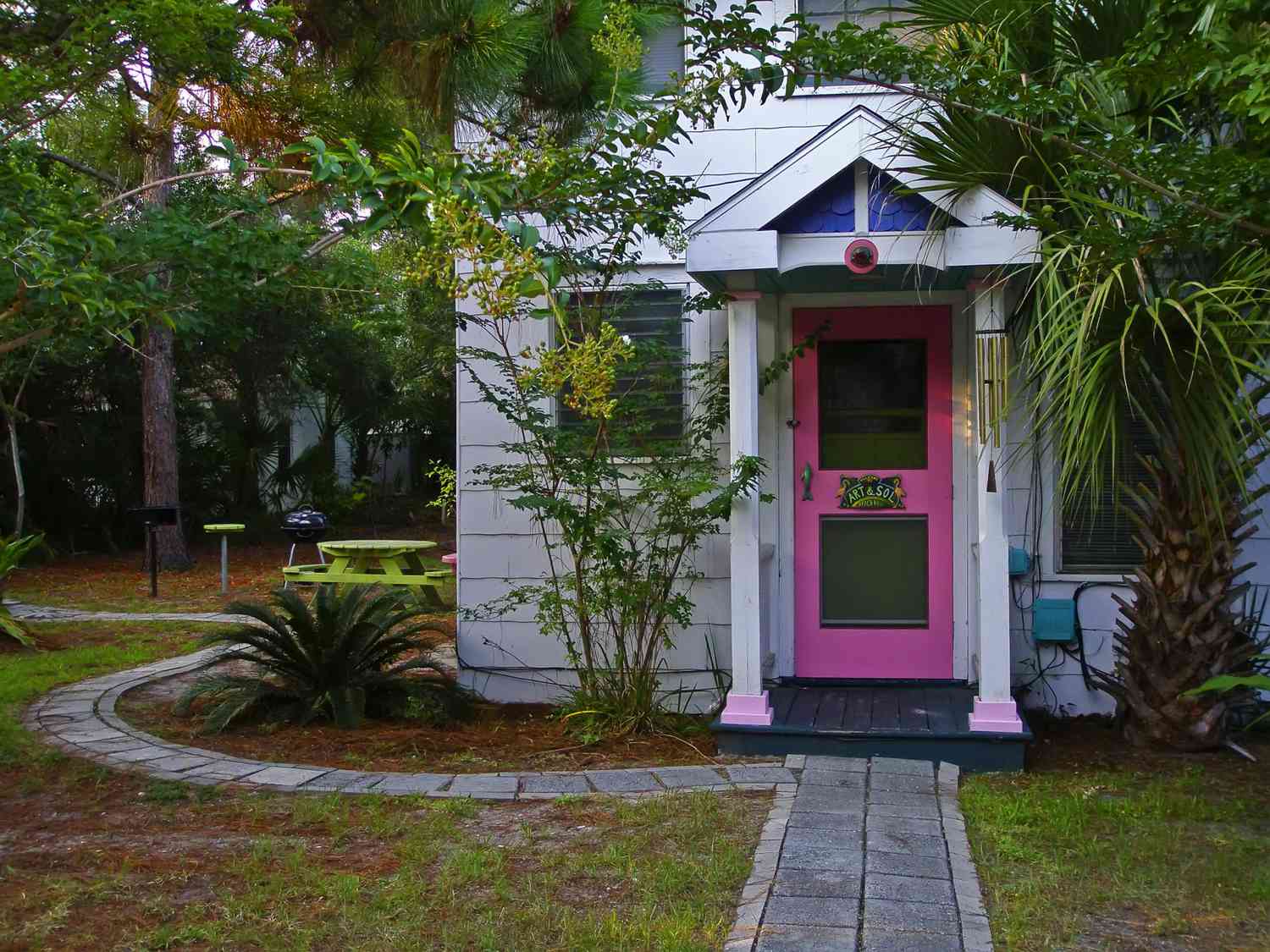 Pink front door of beach cottage