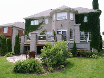 Photo of yard with deck.