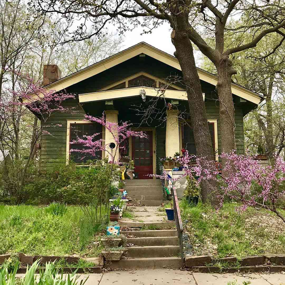 Hunter green and tan craftsman home