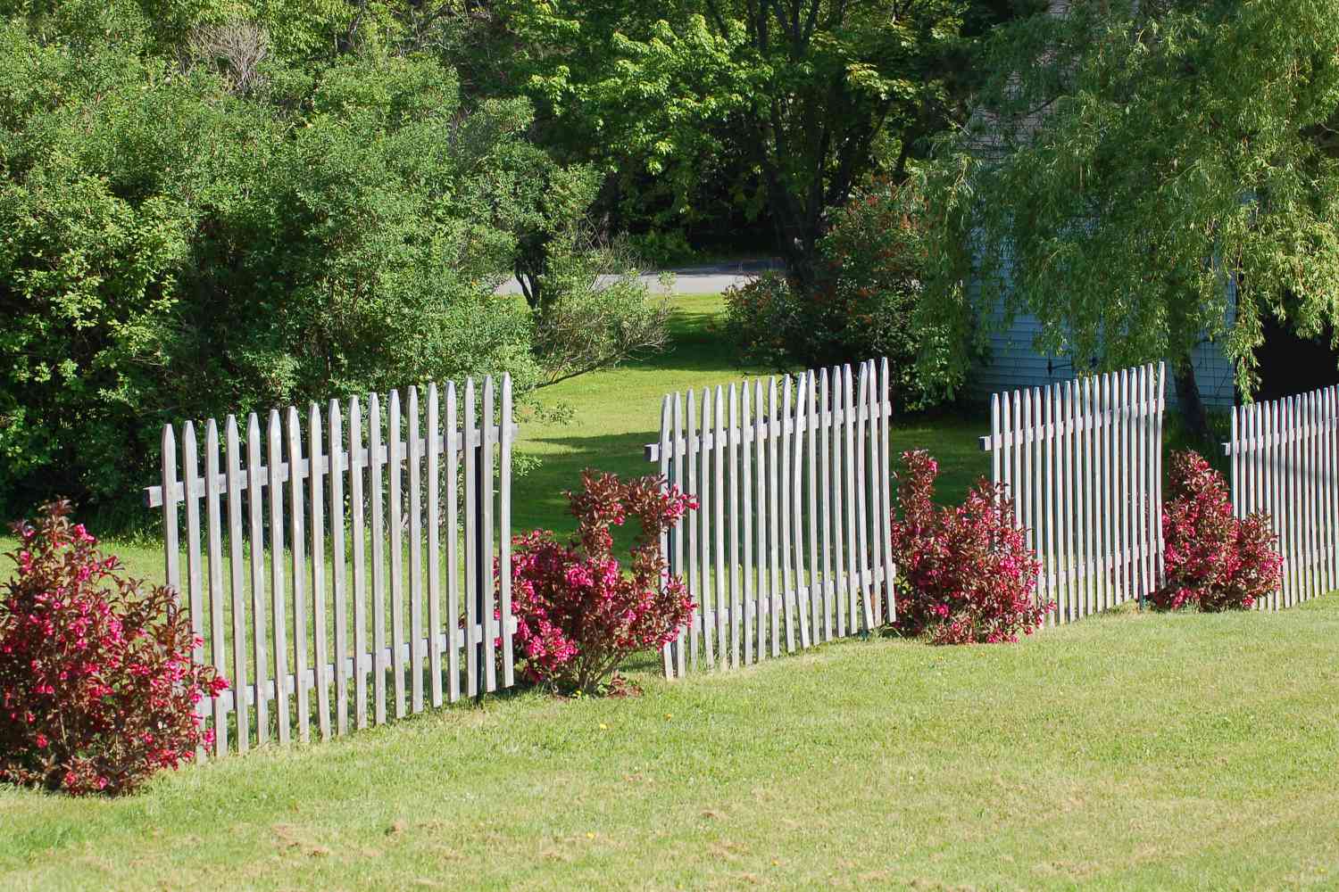 Breaking up a fence with landscaping