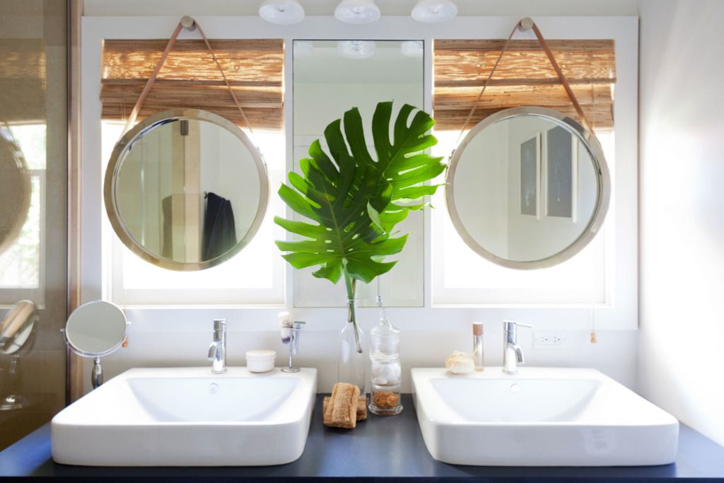 porthole inspired mirrors in bathroom