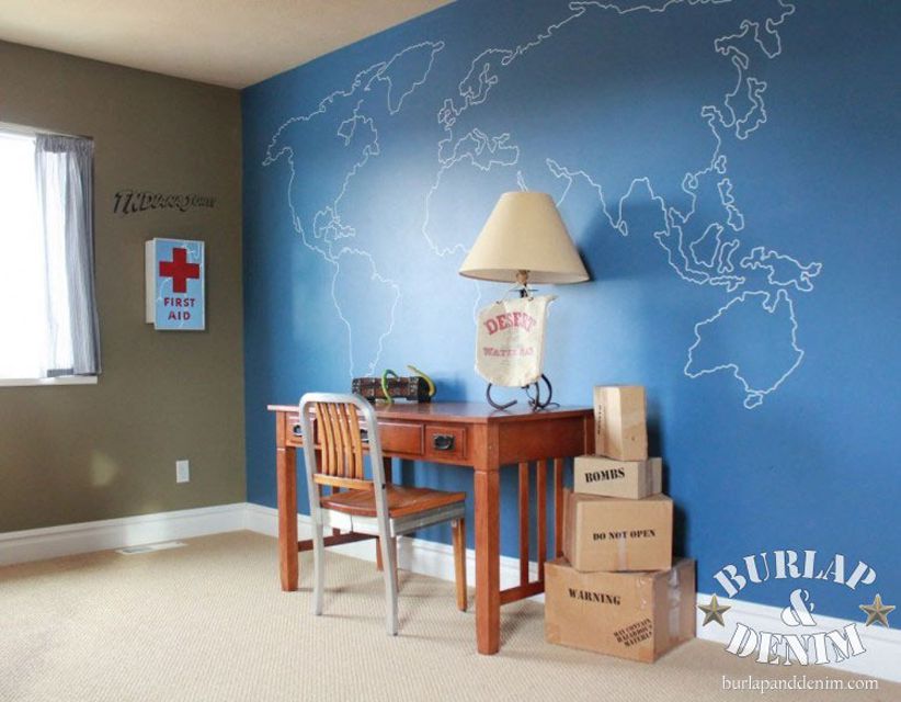 blue Sharpie art map accent wall in kids room with desk and chair