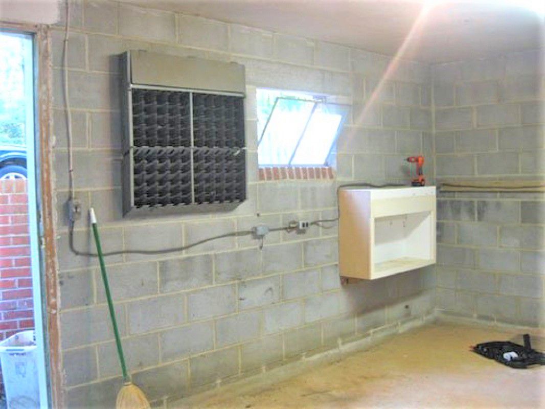 Basement With Cinderblock Walls Before Remodel