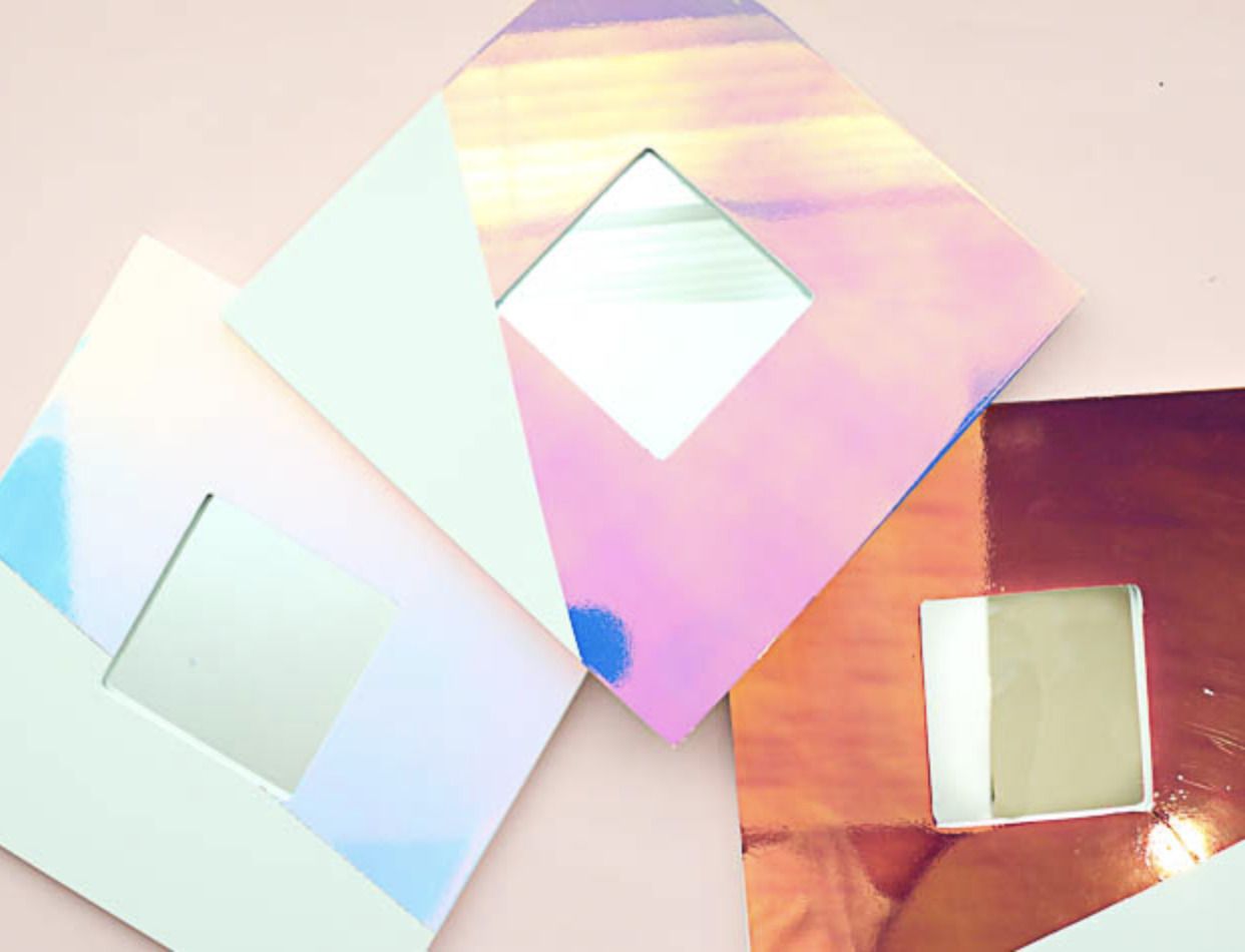 a DIY mirror frame made using holographic contact paper