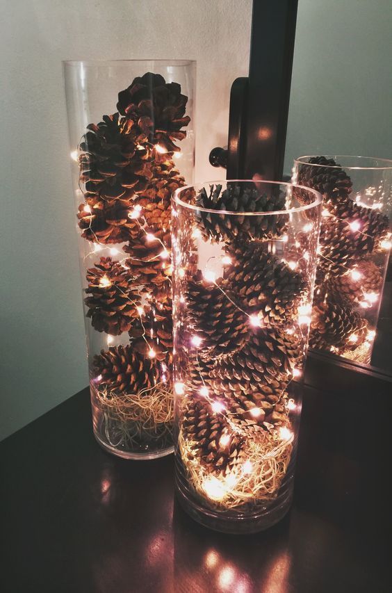 lights and pinecone centerpiece in glass container