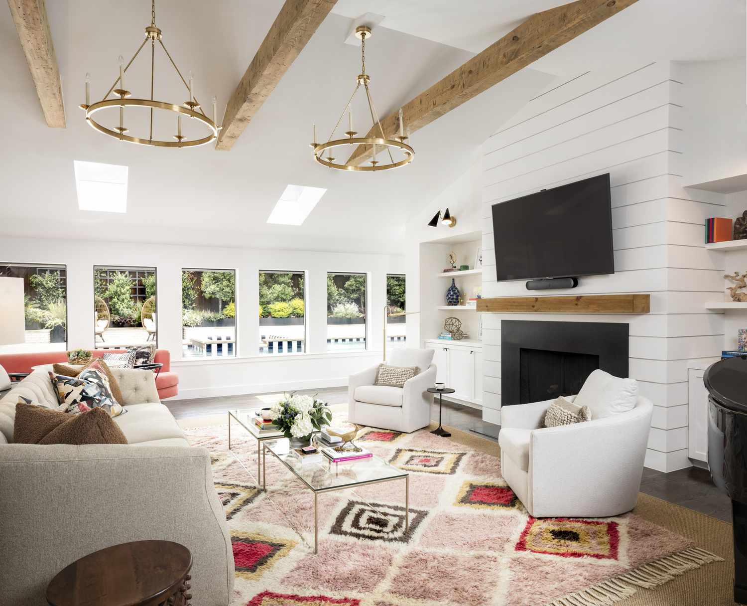 boho rug in great room with beams
