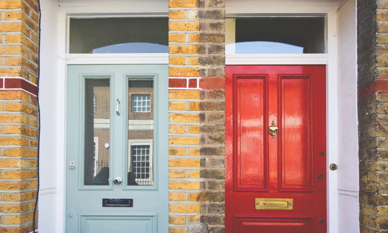 green and red front doors next to each other