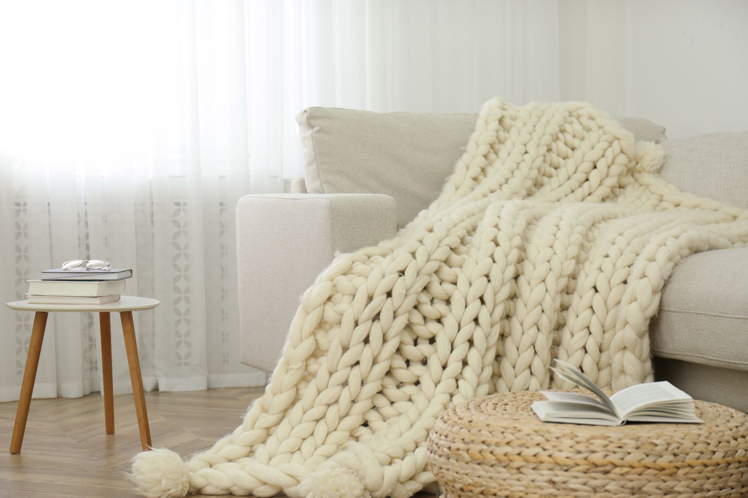 A chunky throw blanket on a couch