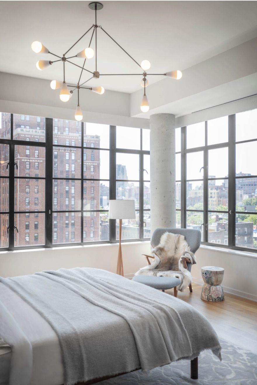neutral bedroom with industrial modern accents and cool tones