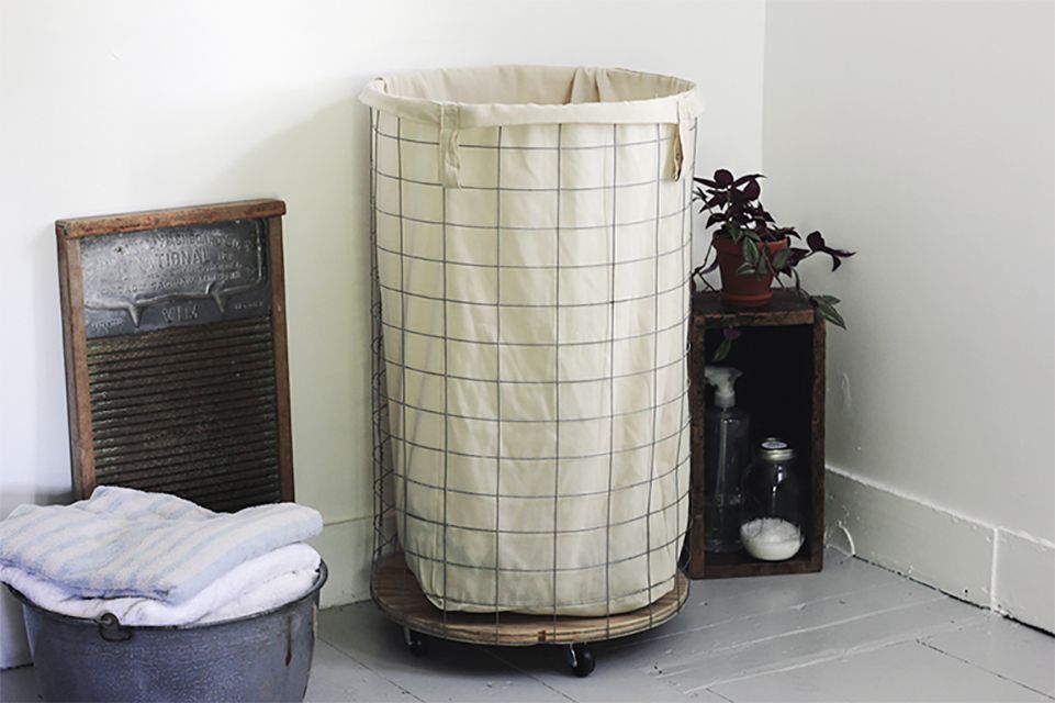 A wire and cloth laundry hamper
