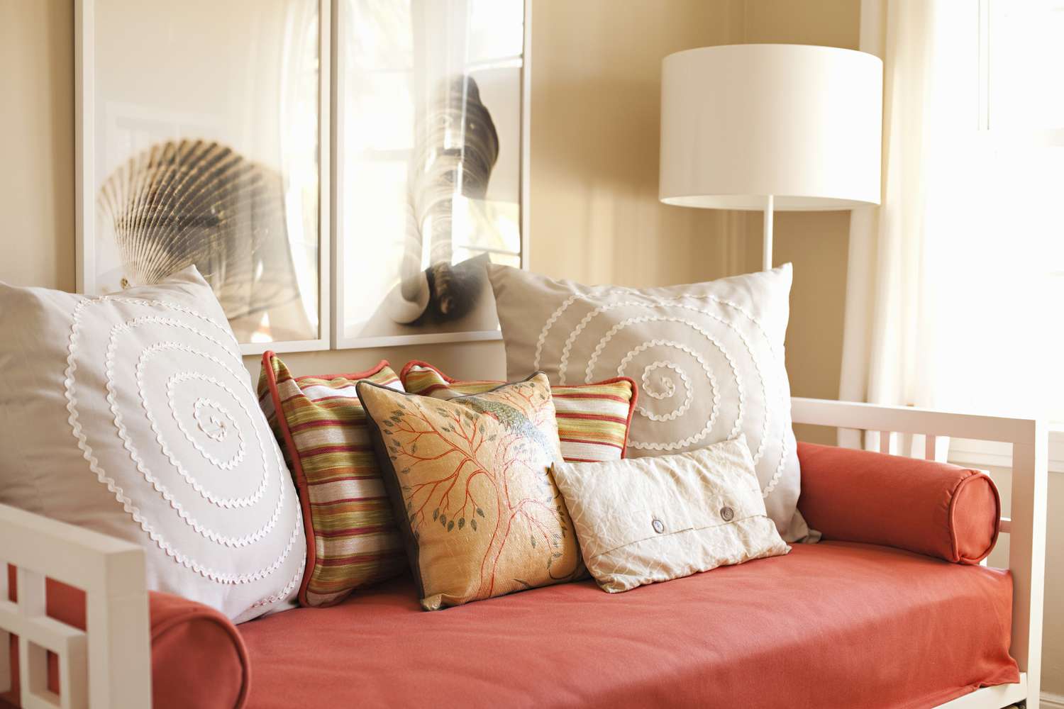 white daybed with colorful accent pillows 