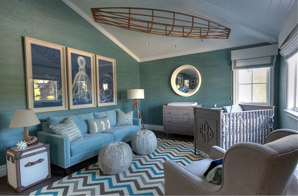Teal and white nautical nursery with boat