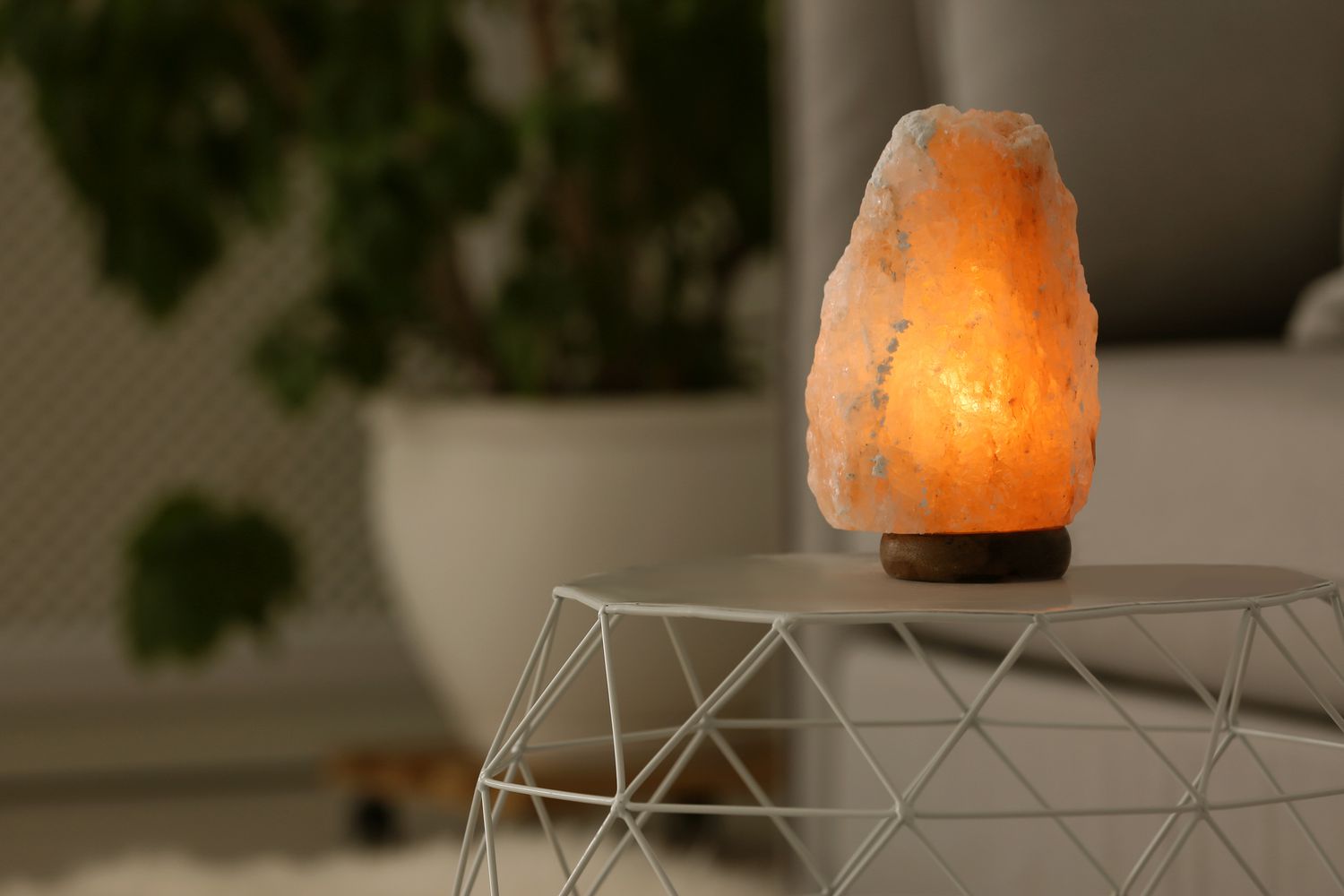 Himalayan salt lamp on a table for space clearing