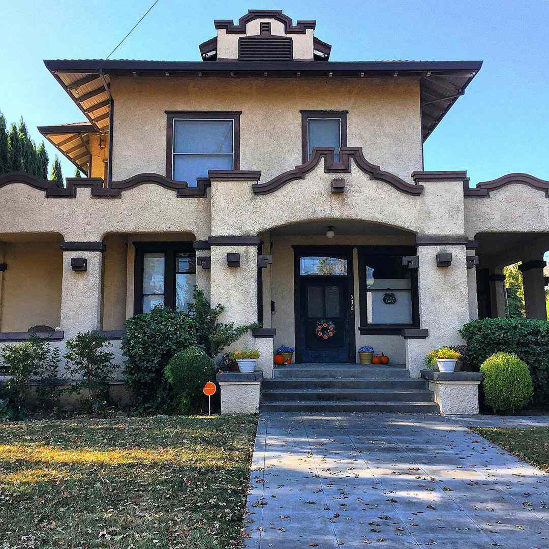 tan two story mission style home