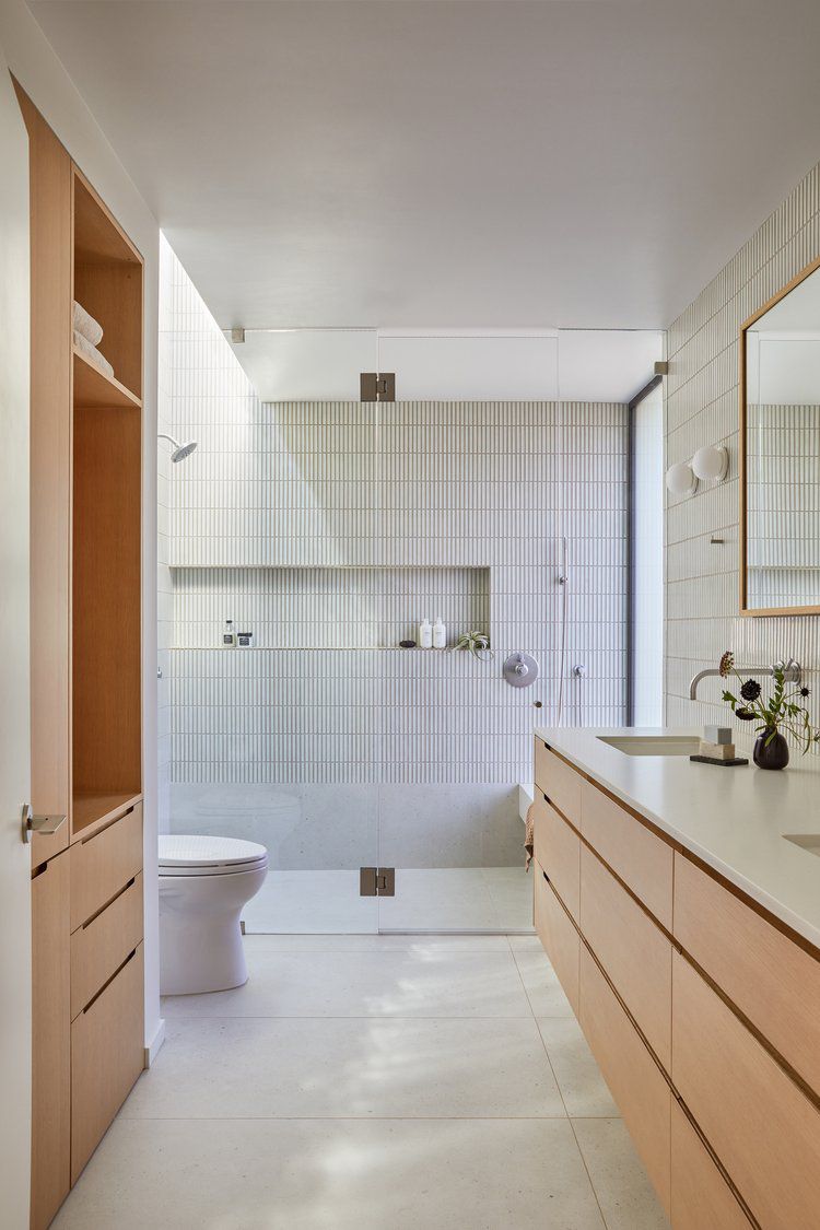 stacked vertical tile bathroom accent wall