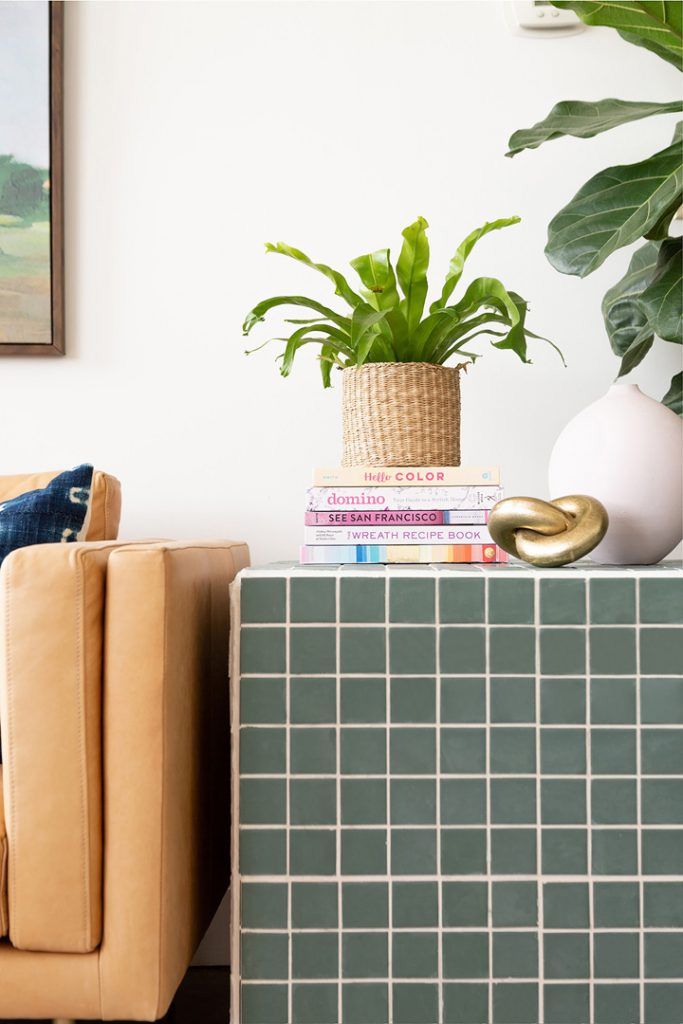 A green tiled DIY side table