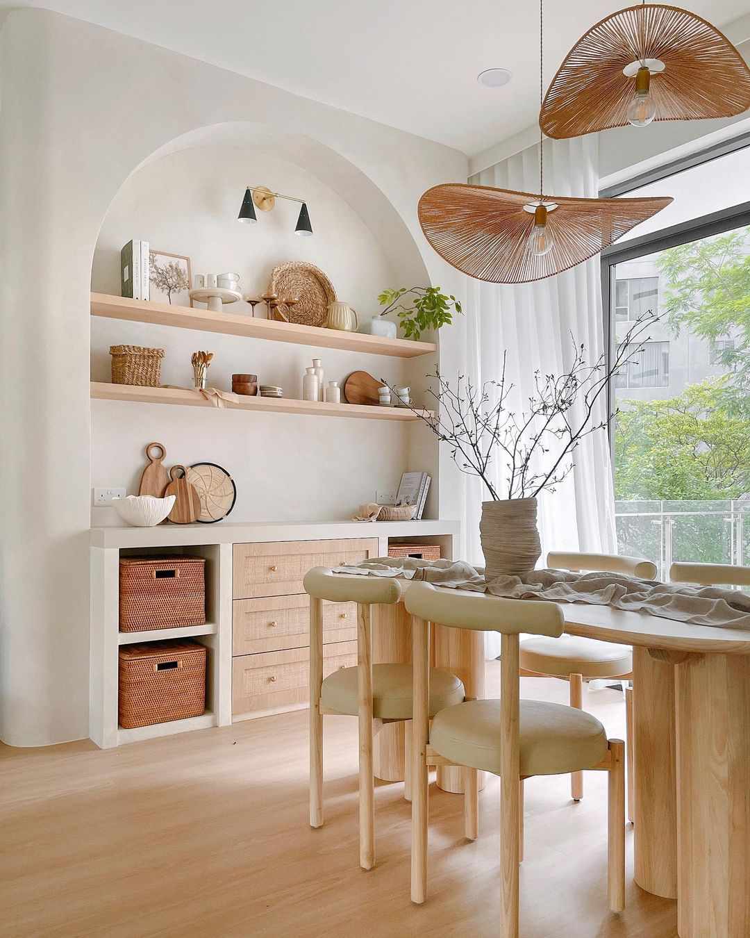 Wicker storage cubes used in open shelving in a dining room