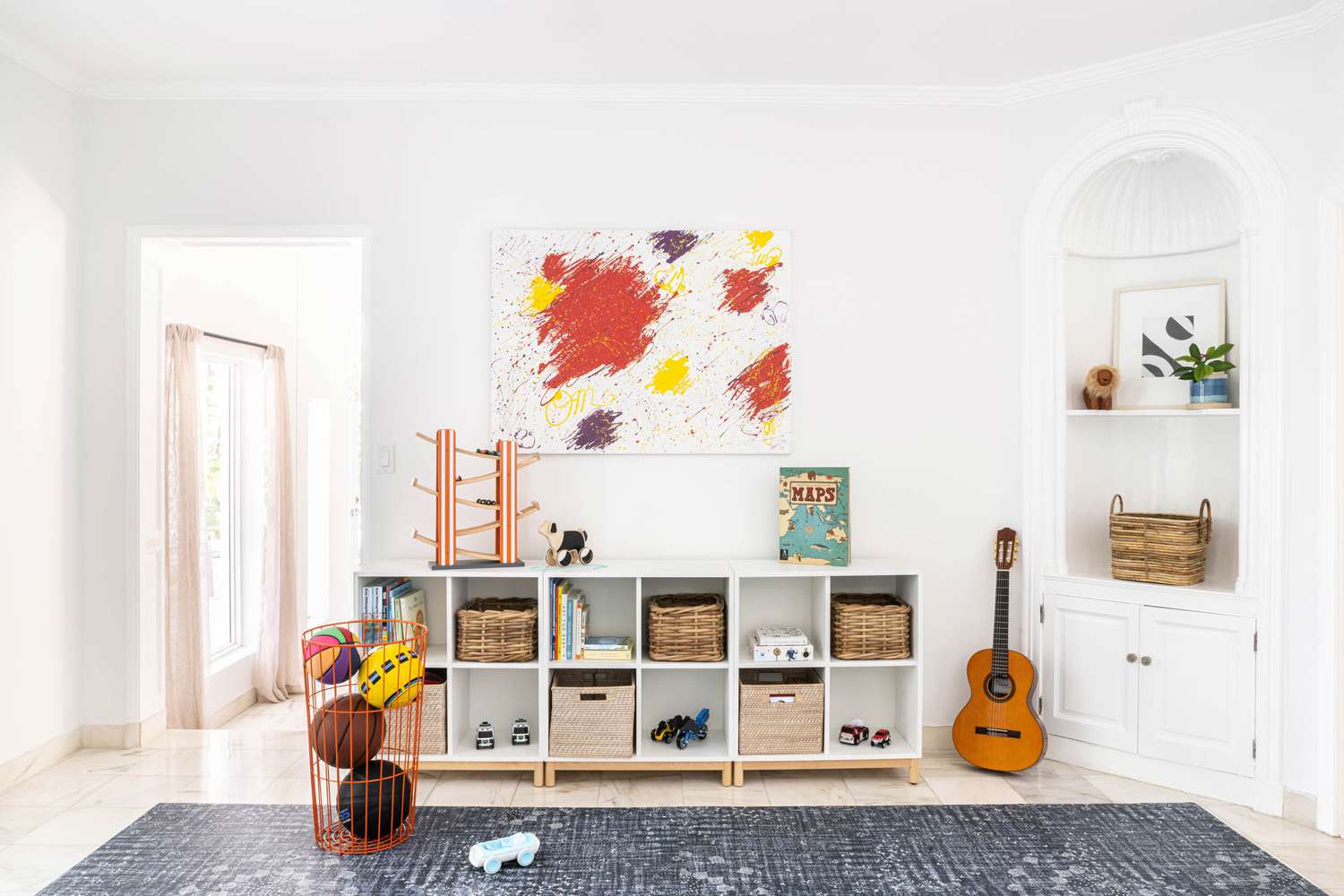 Storage cubes in a cubbie shelf in a playroom