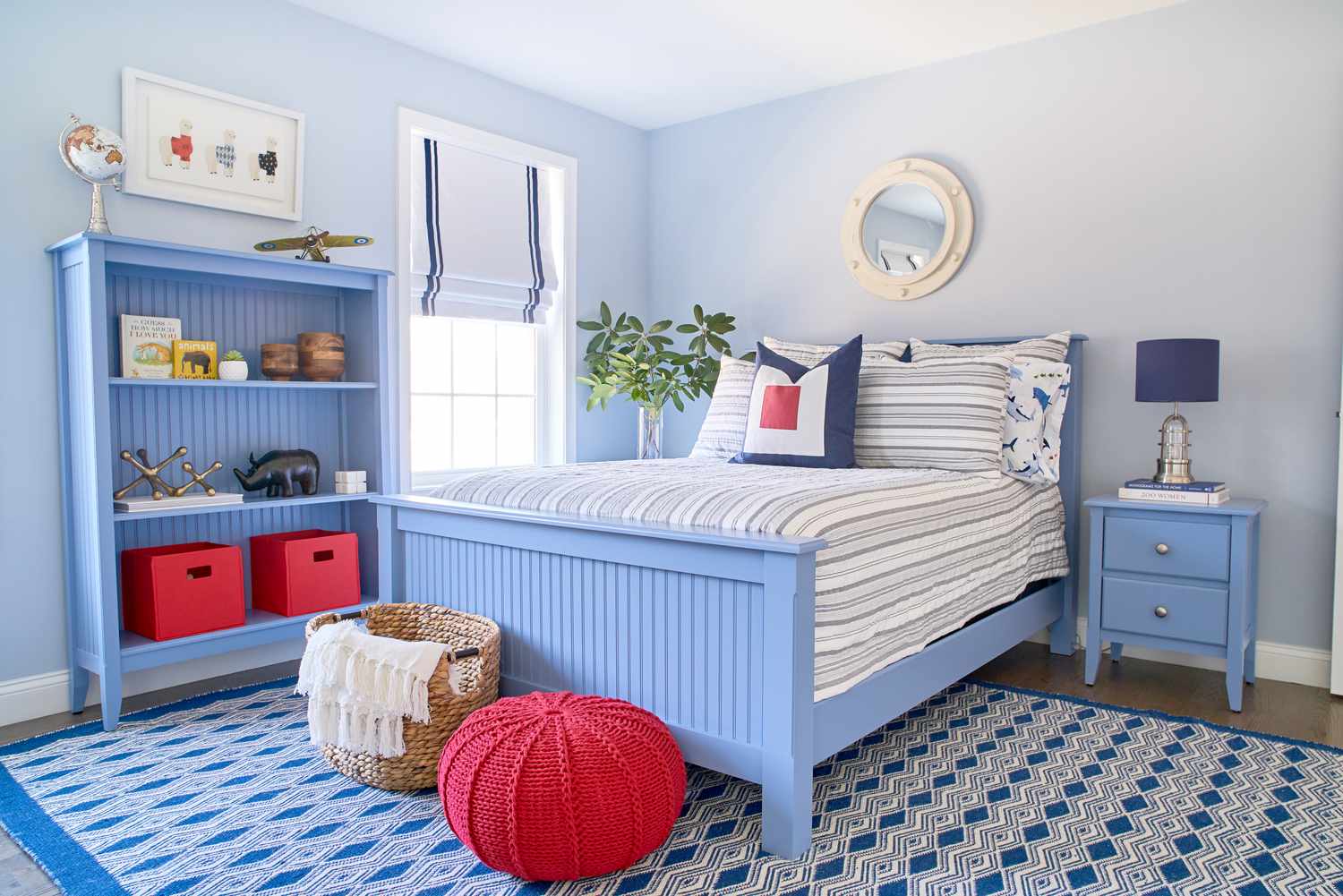 Red storage cubes on a blue shelf in a kid's bedroom