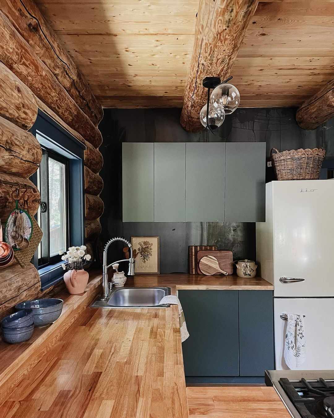 cabin kitchen with green cabinets