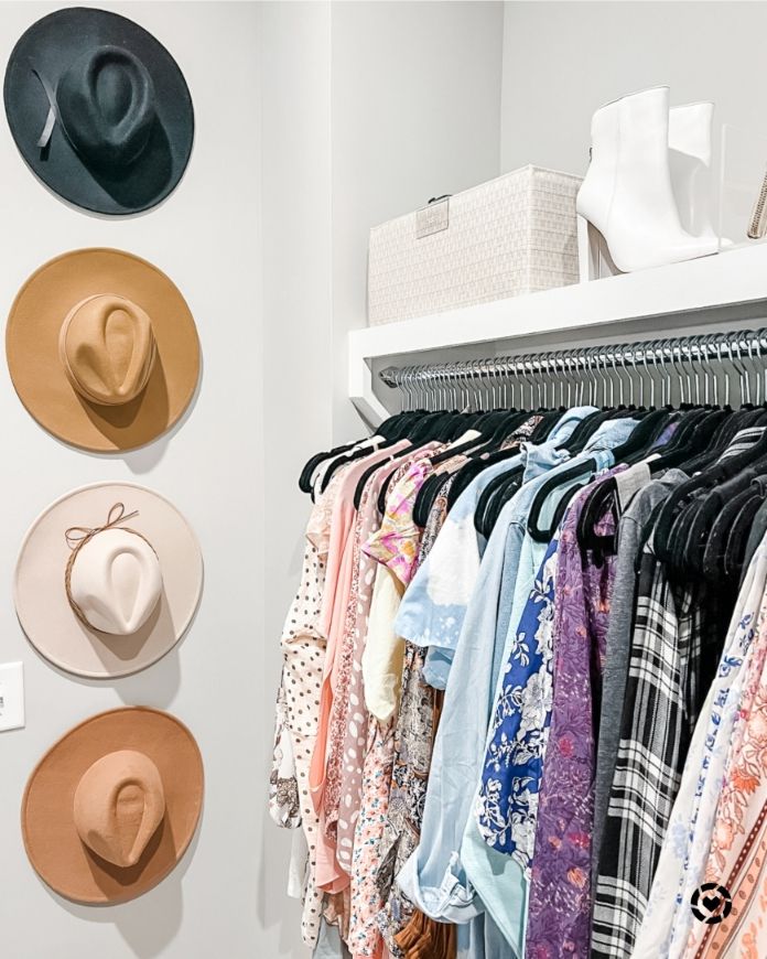 Hats hanging on a closet wall