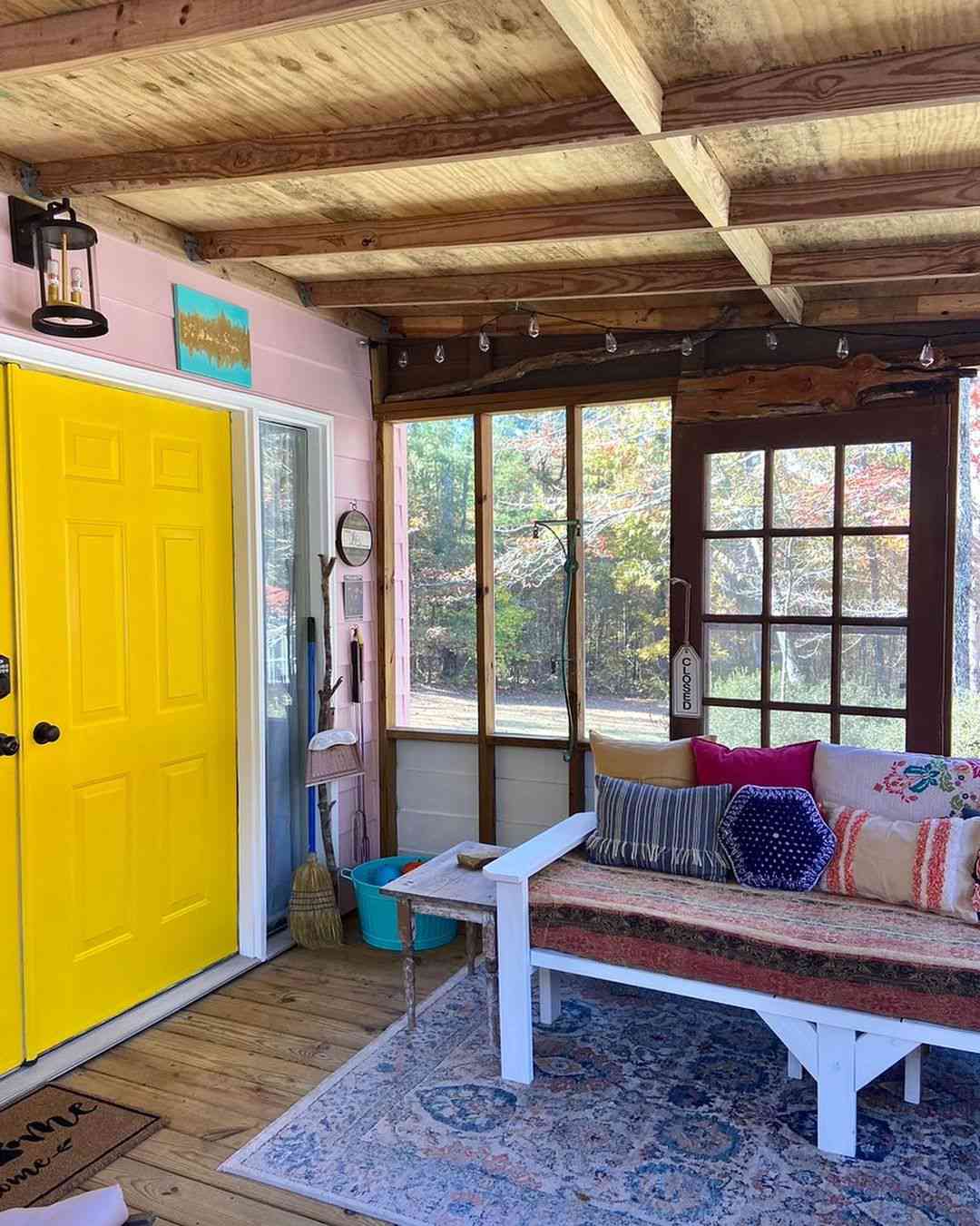 screen porch with yellow door