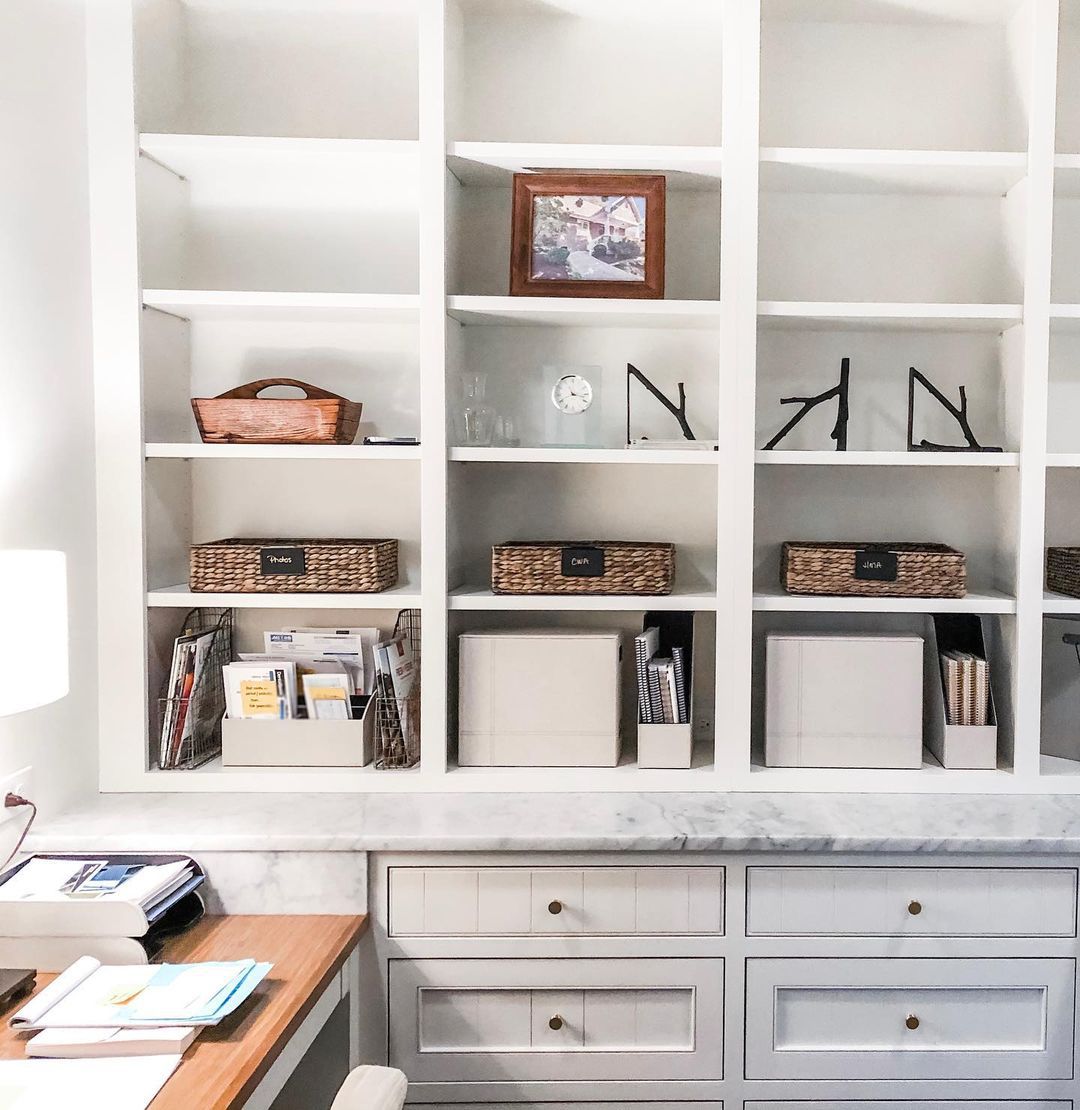 Shelves in a home office filled with various organizers