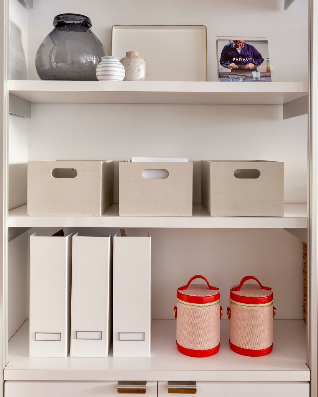 File holders and storage bins on open shelves